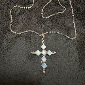 Silver 925, Mother of Pearl (blue) set in a Beautiful Filigree Cross.
GORGEOUS